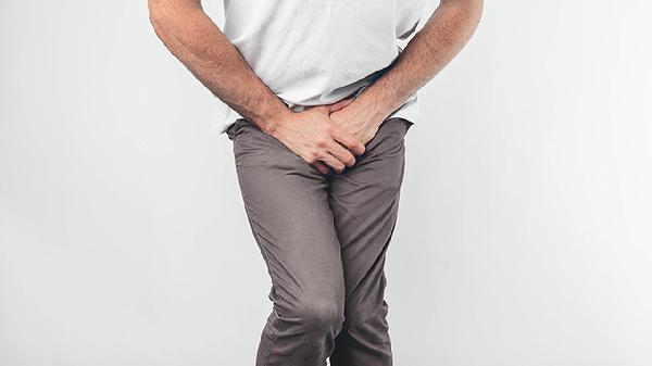 What are the causes of frequent nighttime urination in men?